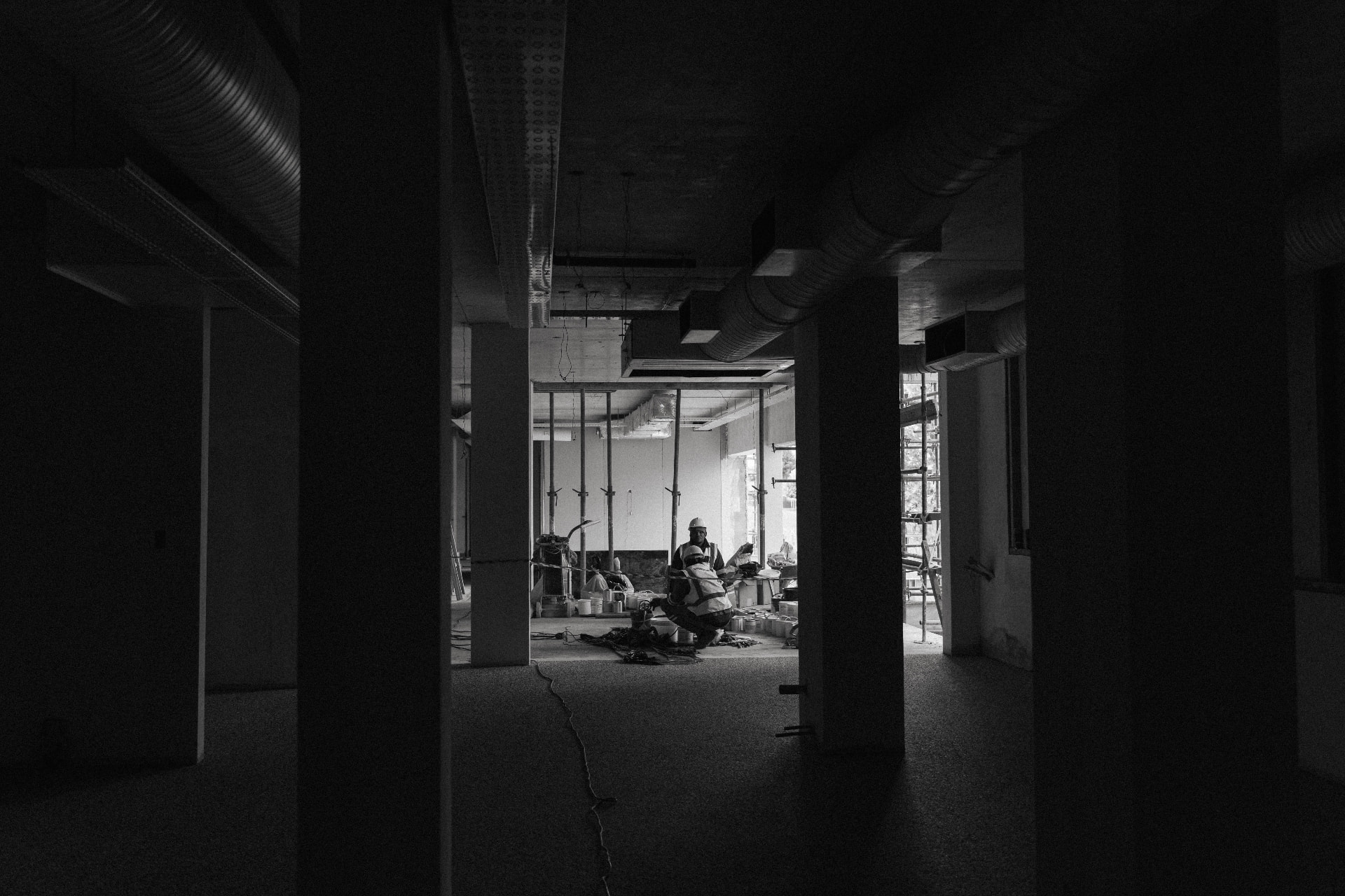 Nuvo installers working on site between concrete pillars
